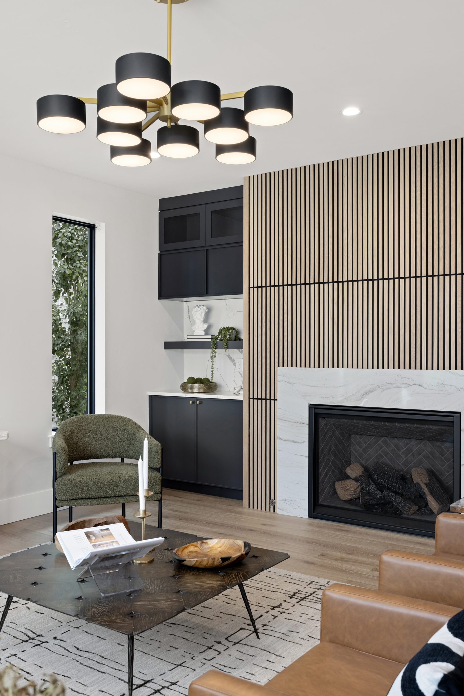 Living room framed by a dramatic vertical wood slat wall
